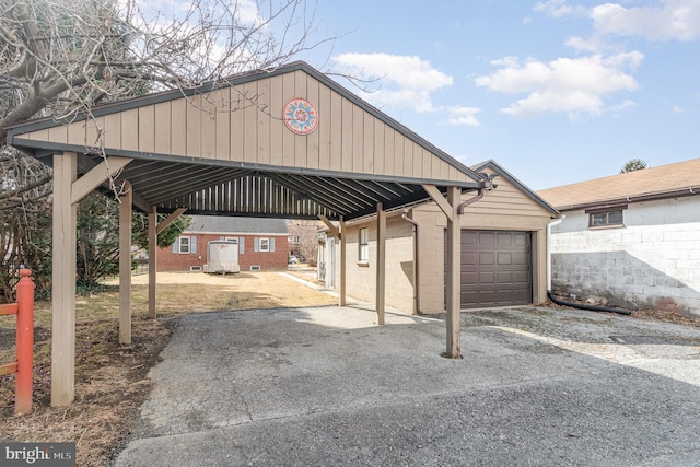 view of parking with a garage and driveway