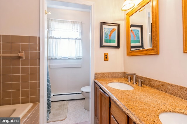 full bathroom with toilet, a sink, baseboard heating, double vanity, and tiled tub