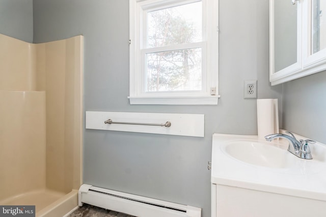 bathroom with a walk in shower, a baseboard radiator, and vanity