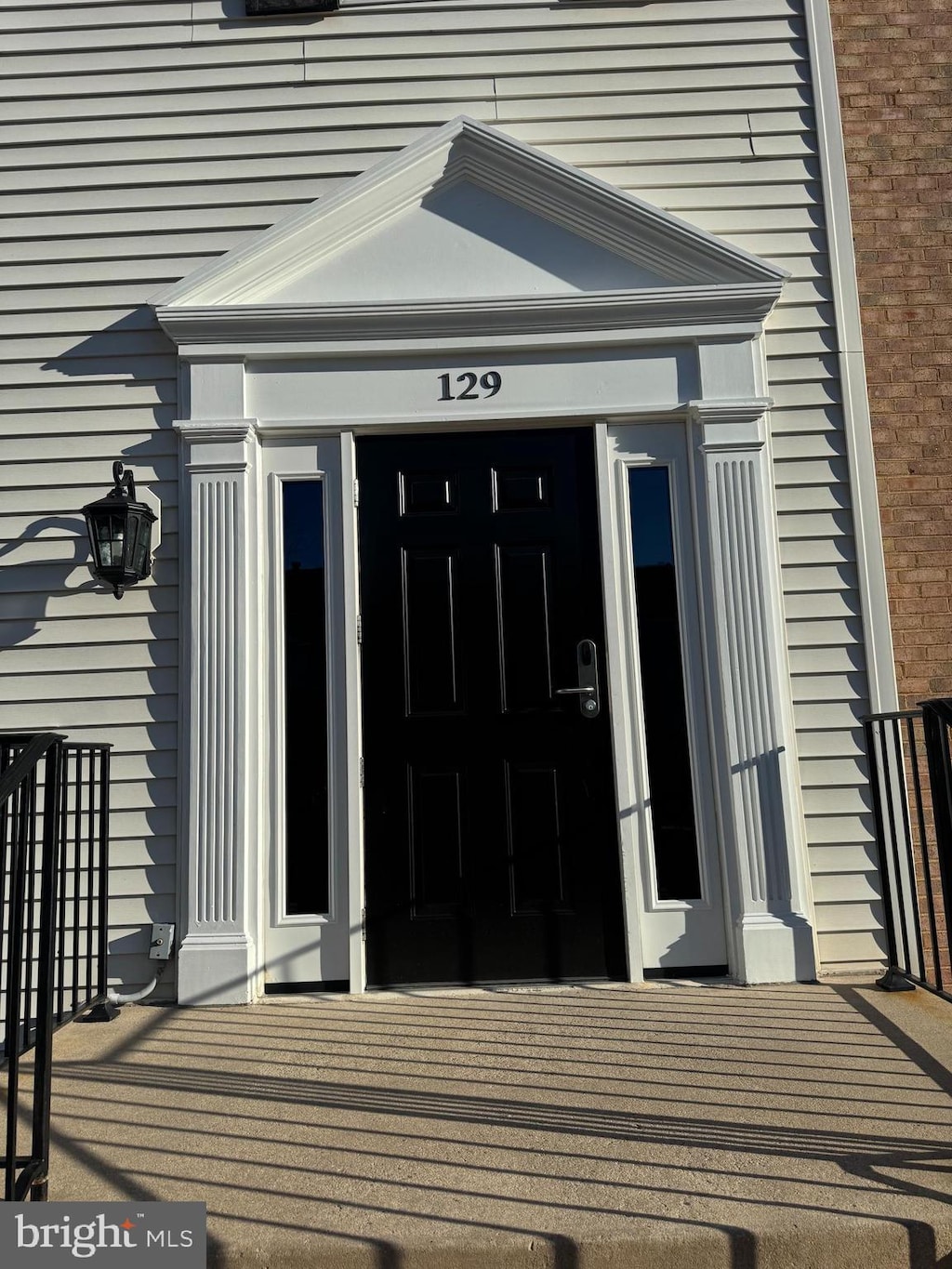 property entrance with brick siding