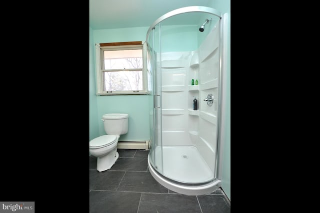 bathroom featuring baseboard heating, tile patterned flooring, toilet, and a stall shower