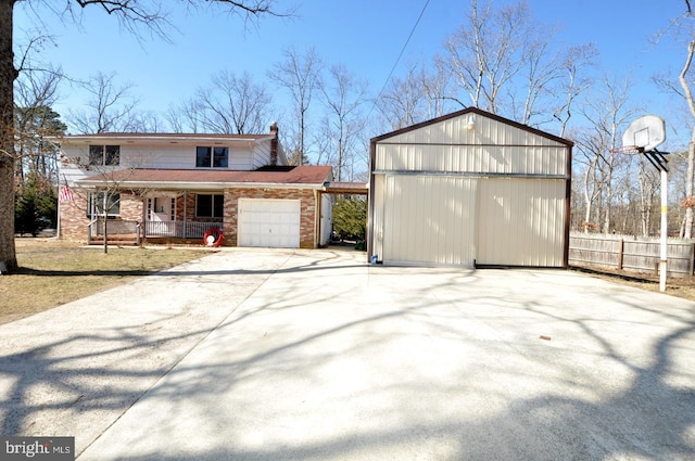 exterior space with an attached garage, covered porch, brick siding, fence, and driveway