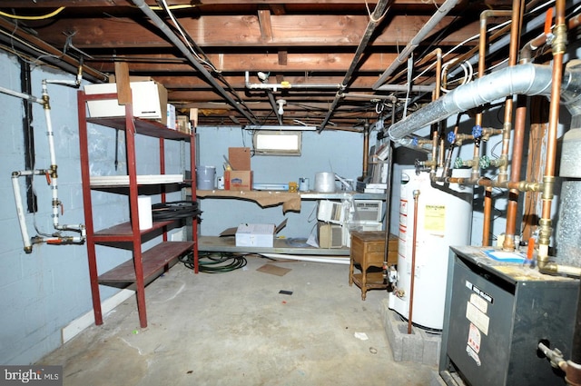 basement featuring concrete block wall, water heater, and a heating unit