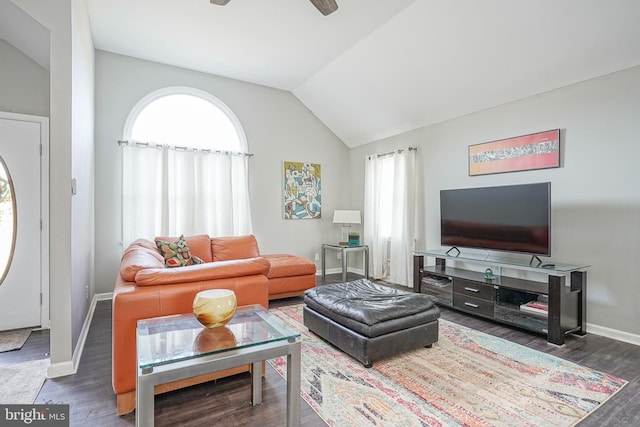 living room with vaulted ceiling, ceiling fan, dark wood finished floors, and baseboards