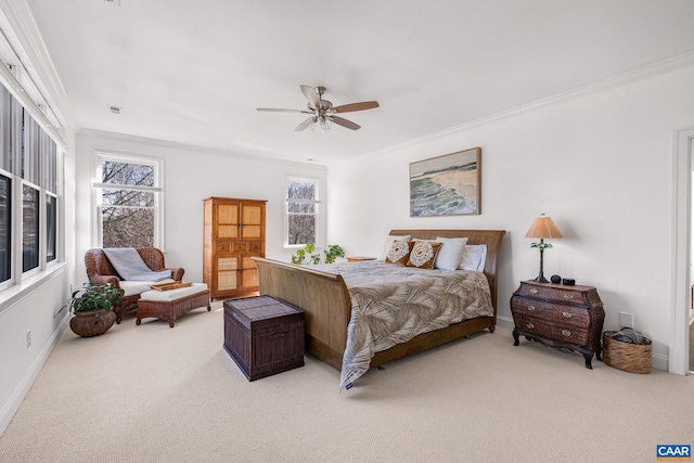 bedroom featuring crown molding, multiple windows, ceiling fan, and carpet flooring