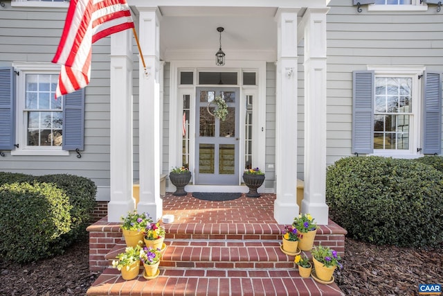 property entrance with brick siding