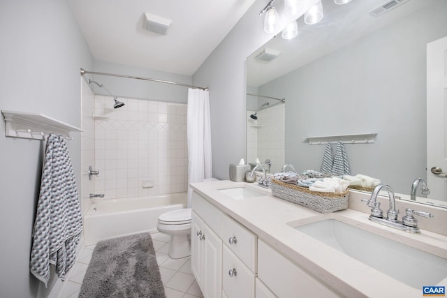 full bath featuring toilet, tile patterned flooring, visible vents, and a sink