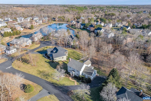 drone / aerial view with a residential view and a water view