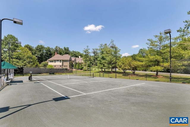 view of sport court with fence