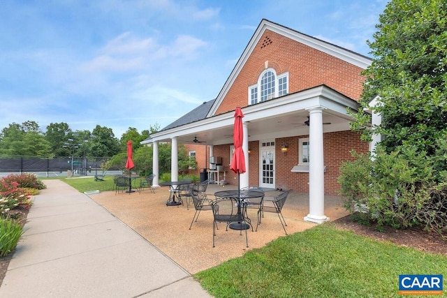 view of home's community with a patio area and fence