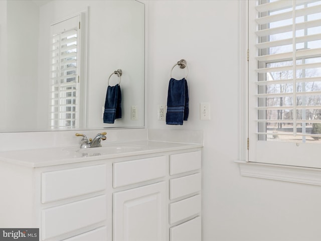 bathroom with plenty of natural light and vanity