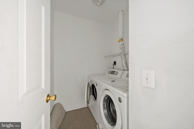 laundry room featuring laundry area and washing machine and clothes dryer