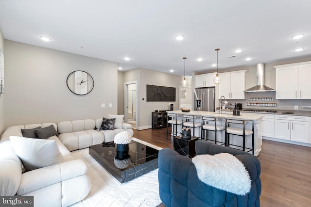 living room featuring recessed lighting, visible vents, and wood finished floors