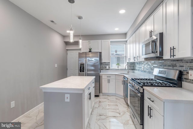 kitchen featuring marble finish floor, stainless steel appliances, a sink, and visible vents