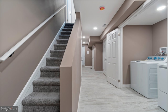 clothes washing area featuring recessed lighting, laundry area, visible vents, baseboards, and washer and dryer