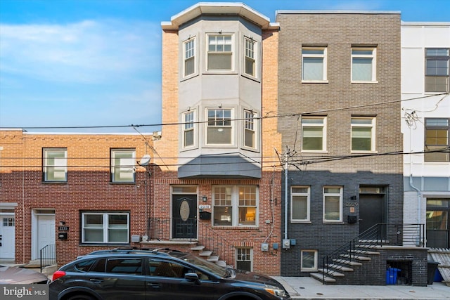 view of property featuring brick siding