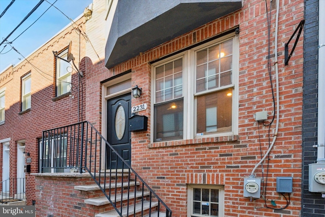 entrance to property with brick siding