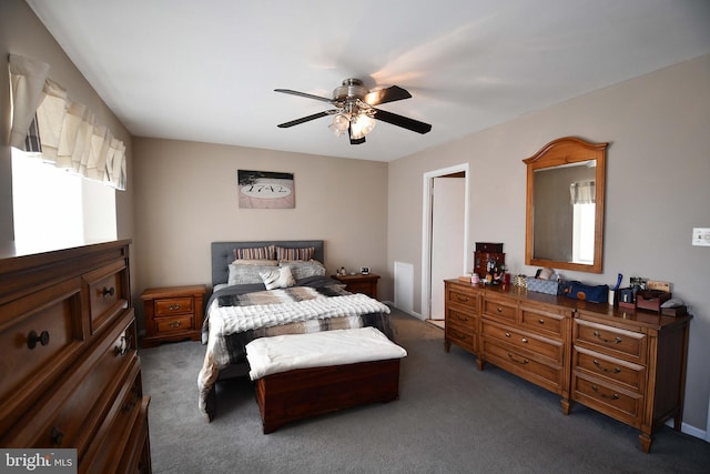 bedroom featuring ceiling fan and dark colored carpet