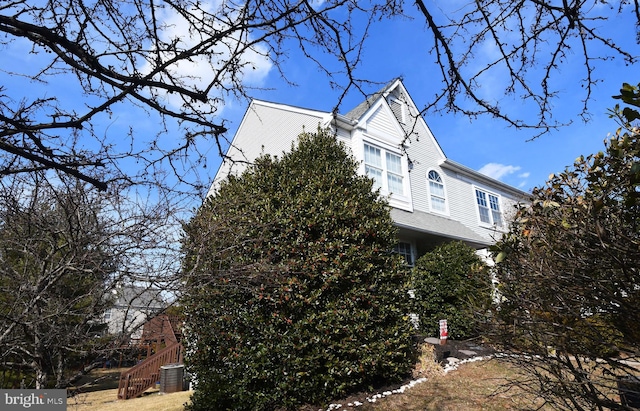 view of property exterior featuring stairs