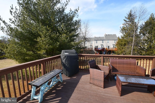 wooden terrace featuring grilling area