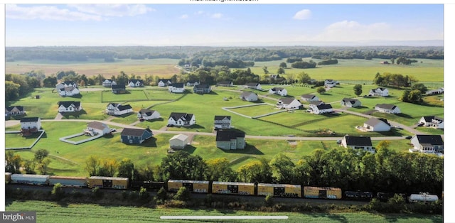 birds eye view of property featuring a rural view