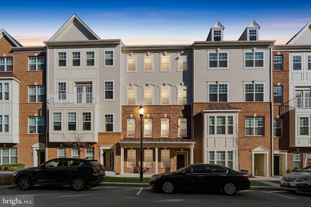 view of front of house with brick siding