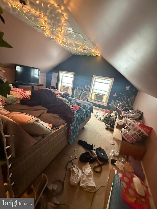 carpeted bedroom featuring lofted ceiling