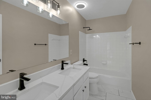 full bath featuring marble finish floor, tub / shower combination, a sink, and toilet