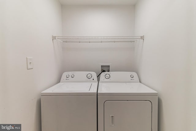 laundry room featuring laundry area and washing machine and clothes dryer