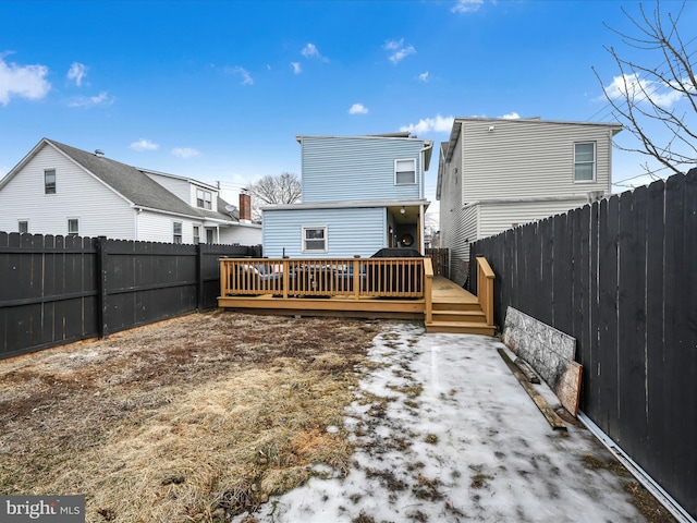 back of house with a deck and a fenced backyard