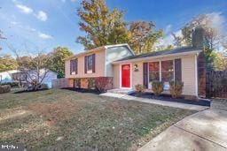 split level home featuring a front lawn