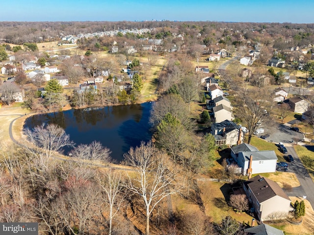 drone / aerial view featuring a water view and a residential view