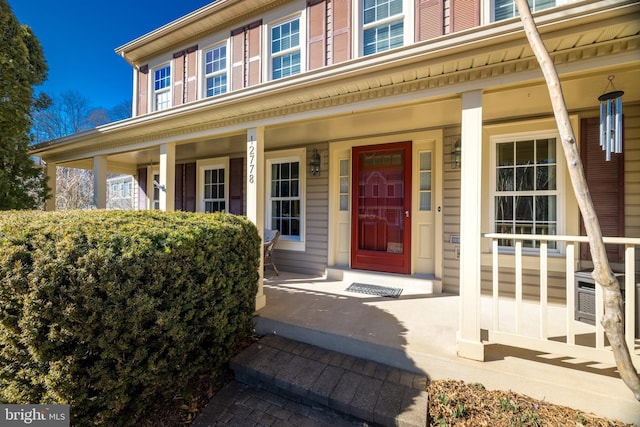 doorway to property featuring covered porch