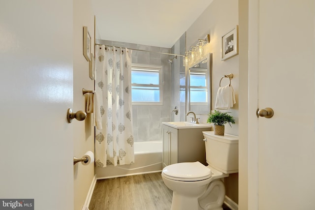 full bathroom with a sink, shower / bathtub combination with curtain, toilet, and wood finished floors