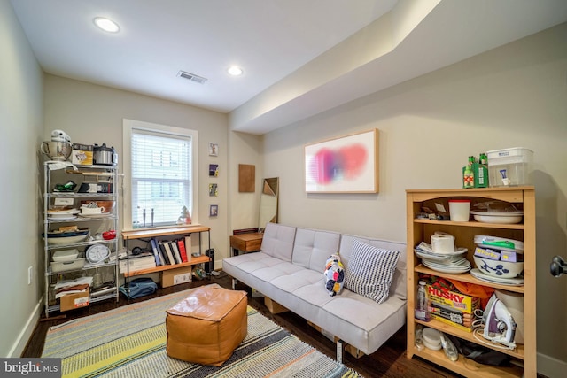 interior space with recessed lighting, wood finished floors, visible vents, and baseboards