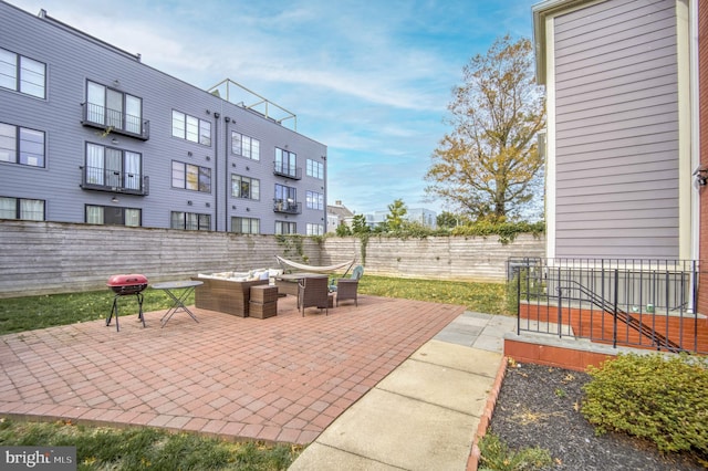 view of patio / terrace featuring fence and an outdoor hangout area