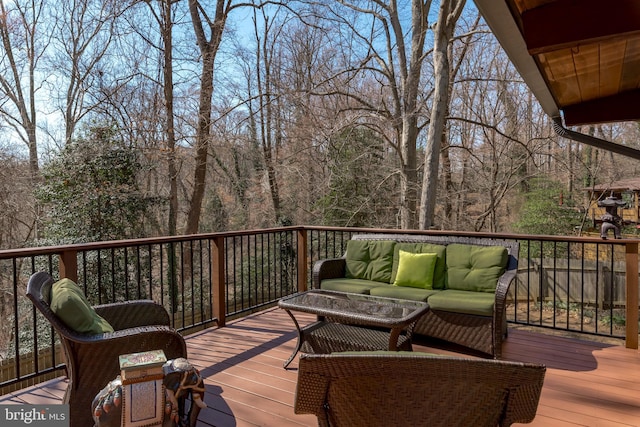 wooden deck featuring outdoor lounge area