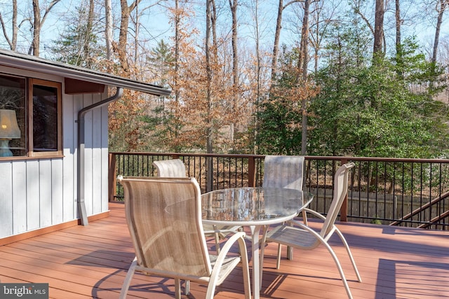 wooden deck with outdoor dining area