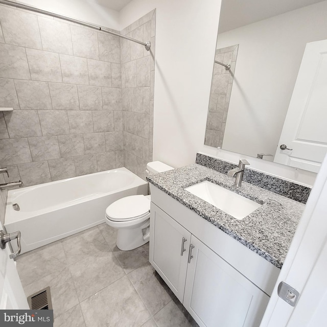 full bathroom featuring shower / bathtub combination, toilet, vanity, visible vents, and tile patterned floors