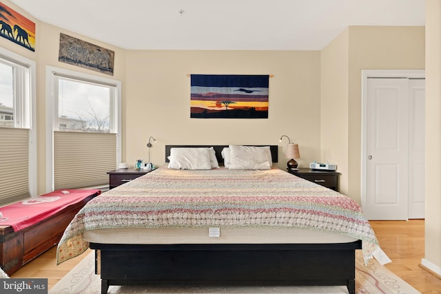 bedroom with light wood finished floors