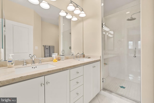 bathroom featuring a stall shower and a sink