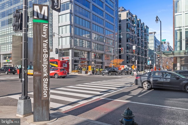 913 4th St SE, Washington, DC 20003 - view of asphalt street with sidewalks, traffic signs, a view of city, and street lights