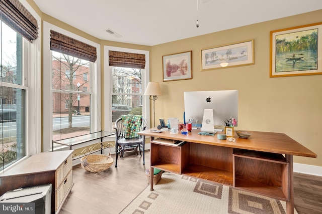 office featuring visible vents and baseboards