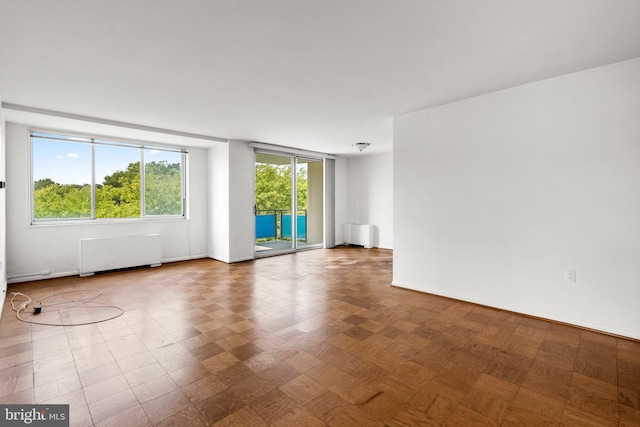 empty room featuring radiator heating unit