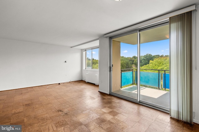 doorway featuring baseboards