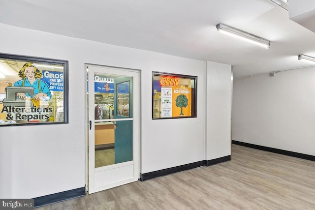 interior space with light wood-style flooring and baseboards