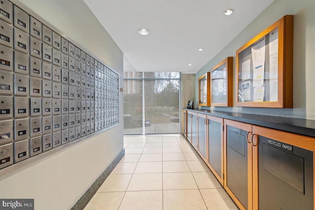 interior space with recessed lighting, mail area, and light tile patterned floors