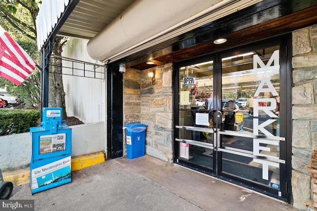 entrance to property with stone siding