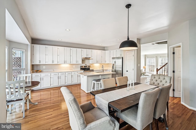 dining room featuring recessed lighting and light wood-type flooring