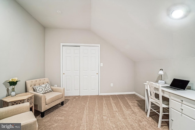 home office featuring baseboards, light colored carpet, and vaulted ceiling